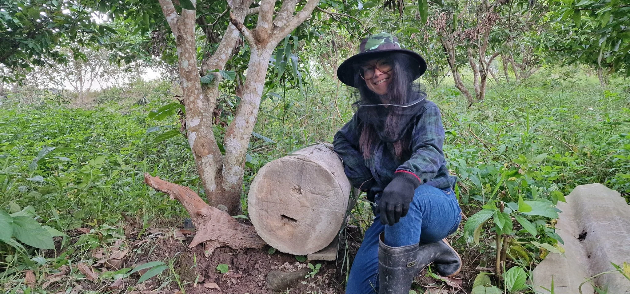 Nate, founder of Save the Bees Thailand, with bee houses on the farm